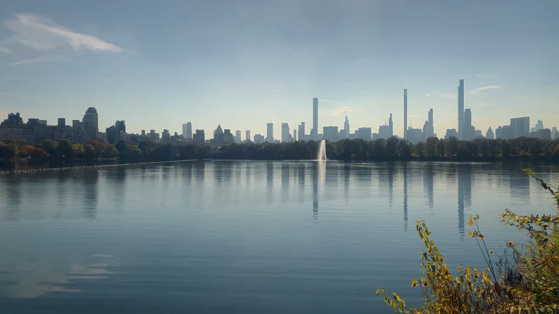 The Reservoir in Central Park, the skyline reflected in still water — after