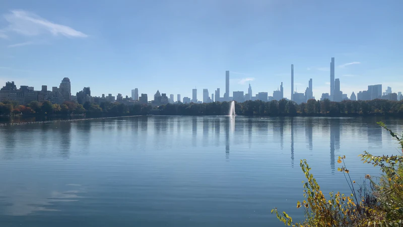 The Reservoir in Central Park, the skyline reflected in still water — before